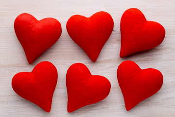 Red hearts the gray background. Valentine Day background.