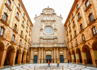 Santa Maria de Montserrat Abbey in Monistrol de Montserrat, Catalonia, Spain. - obrazy, fototapety, plakaty