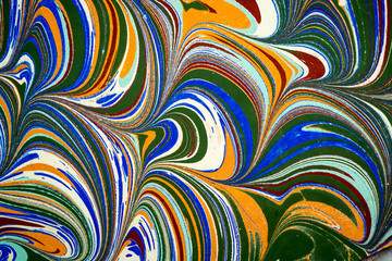 Ebru art. Traditional Turkish Ebru technique. Painting on water, followed by paper prints. Color paint ebru with waves and tile pattern.