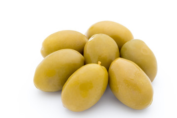 Green big olives on the white background.
