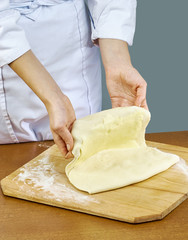 Woman rolls squeezes dough Handmade Series Food recipes