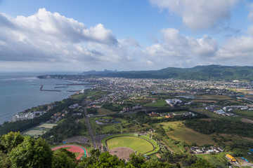 Fototapeta na wymiar Ibusuki town landscape view and blue sky from hill top