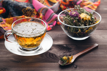 Herbal tea on rustic wooden table