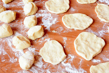 Czech baked buns with jam and sugar. Baking cakes. Traditional Czech recipe for buns. Festive delicacies. Buns on a baking pan.