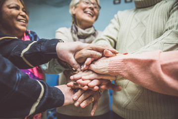 Group of seniors making activities inside the hospice.