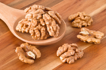 Walnuts in wooden spoon