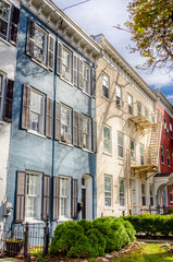 Obraz premium Old Pastel Coloured Row Houses in the Historic Neighbourhood of Geneva, NY