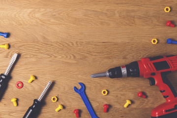 Toys background. Kids toy tools for education on wooden table. Top view. Flat lay. Copy space text