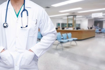 smart doctor with a stethoscope on the hospital blurred background.