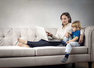 Obraz premium Mother and son using a pc