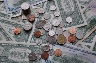 Top view of United States dollars bills and coins 