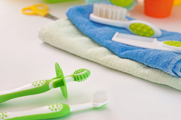 Pair of baby first toothbrushes in the bathroom