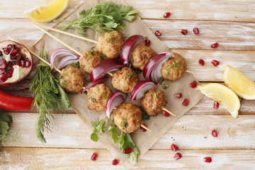 Kofta skewers, meatballs and red onion delicious oriental cuisine, top view