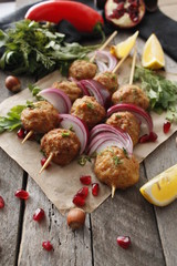 Kofta skewers, meatballs and red onion delicious oriental cuisine, top view