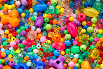 Fototapeta na wymiar Lots of colorful fusible plastic beads used for arts