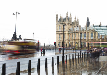 rainy day in London city, people and car traffic. United Kingdom