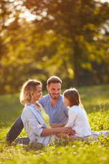 Family in green nature © luckybusiness