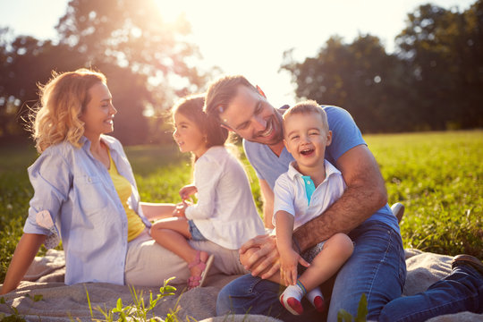 Family with children having fun in nature