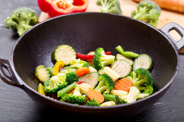 stir fried vegetables in a wok