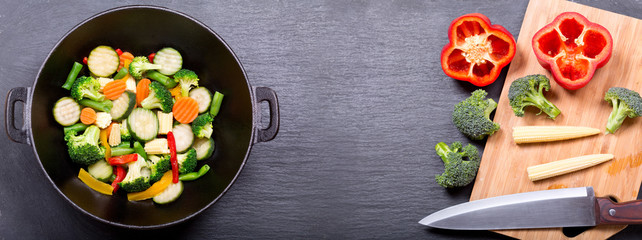 stir fried vegetables in a wok