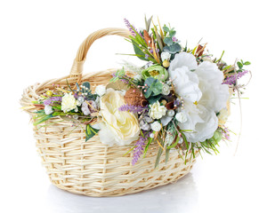 Fototapeta na wymiar Basket decorated with flowers on white background