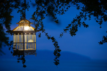 Lanterns hanging from the trees to decorate at sunset bird cage
