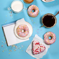 ideal breakfast for the proper energy for the full day. Fresh coffee with milks and donuts . Hipster pictures. Top view