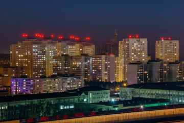 Fototapeta na wymiar Night view to urban modern apartment buildings, Voronezh, Russia