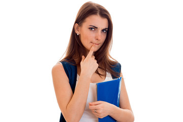 beautiful young girl in white shirt and with a portfolio and balked at holding a blue folder