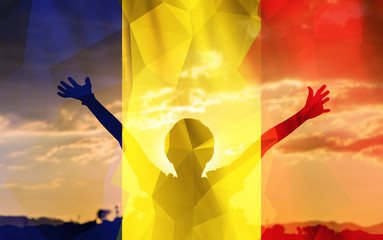 Young man raising his hands on a sunset background with a flag background - 139372468