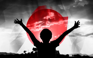Flag of Japan with a sky background and a young man raising hands. - 139373816