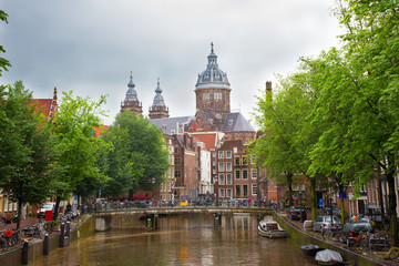 Beautiful cityscape of Amsterdam Canal and St. Nicolas Church