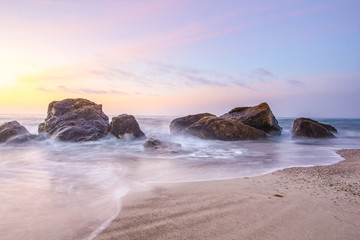 Sunrise on the sea shore. Delicate morning sea