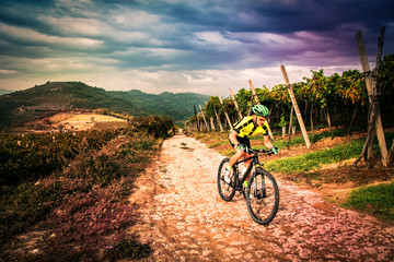 Fototapeta na wymiar Cyclist pedaling through the hills.