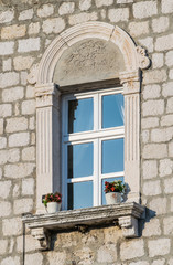 Window feature of a building in the historic center of Rab, Croatia.
