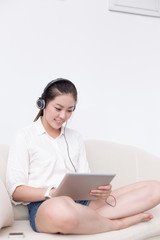 young pretty woman relaxes with tablet