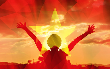 Young man raising his hands on a sunset background with a flag background - 139375695