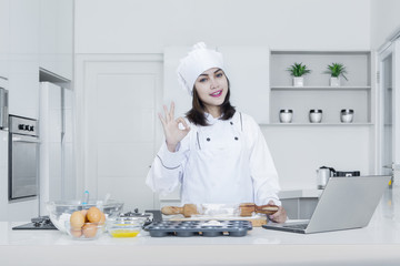 Female baker making delicious bread