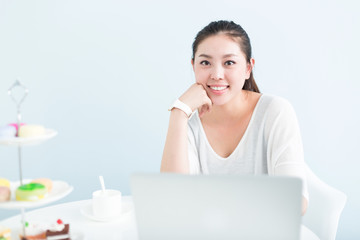 young pretty woman using laptop in office