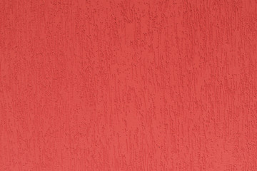 Detail of the facade of the house, wall plastered and painted in color, textured background