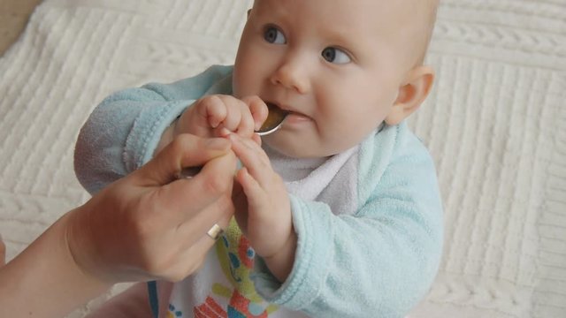 Closeup shot of baby eating first food
