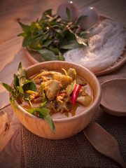 Thai traditional food style Thai vermicelli eaten with green curry chicken hot and spicy(Kanom jean keawwhan kai) on wooden background wallpaper focus one point shallow with depth of field