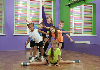 Dance teacher and children in choreography class