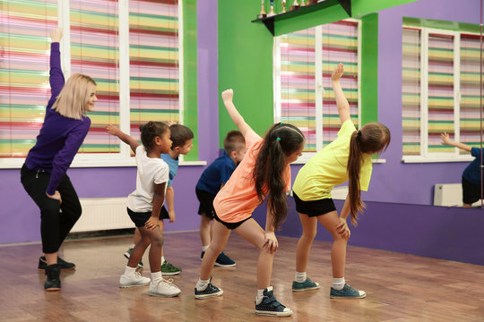 Dance Teacher And Children In Choreography Class