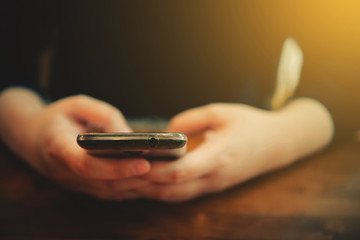 vintage tone women use smartphone on cafe
