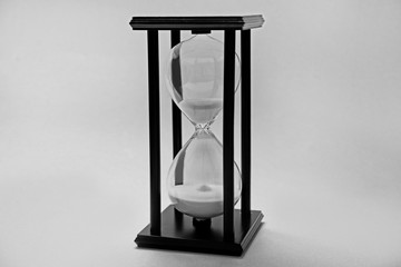 Hourglass on light background