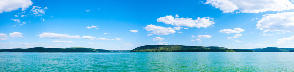 Fototapeta premium The panoram of lake. Riverbank reflecting in the water. Sunny day