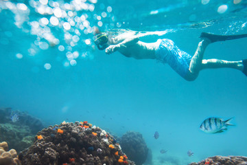 snorkeling on tropical beach, active tourism - obrazy, fototapety, plakaty