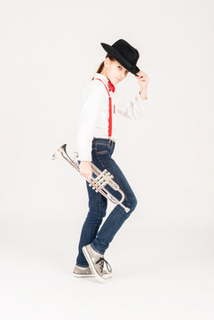 little girl with trumpet on a white background
