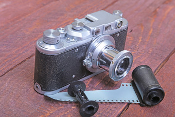 Fototapeta na wymiar Vintage old film photo-camera in leather case